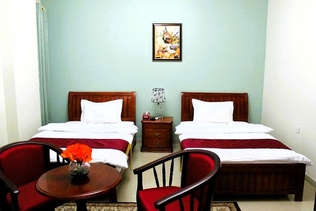 Postel nebo postele na pokoji v ubytování Bahla Hotel Apartments