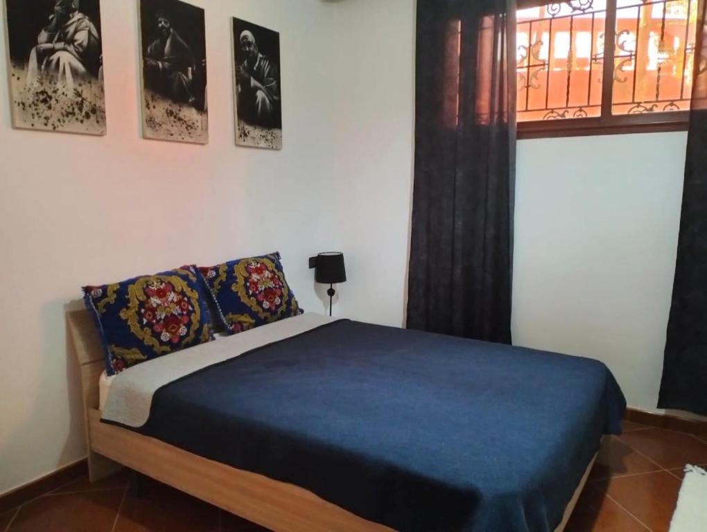 Postel nebo postele na pokoji v ubytování Dar Marwane