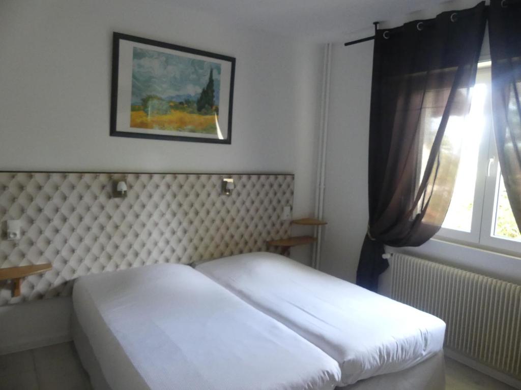 Postel nebo postele na pokoji v ubytování Auberge Obersolberg