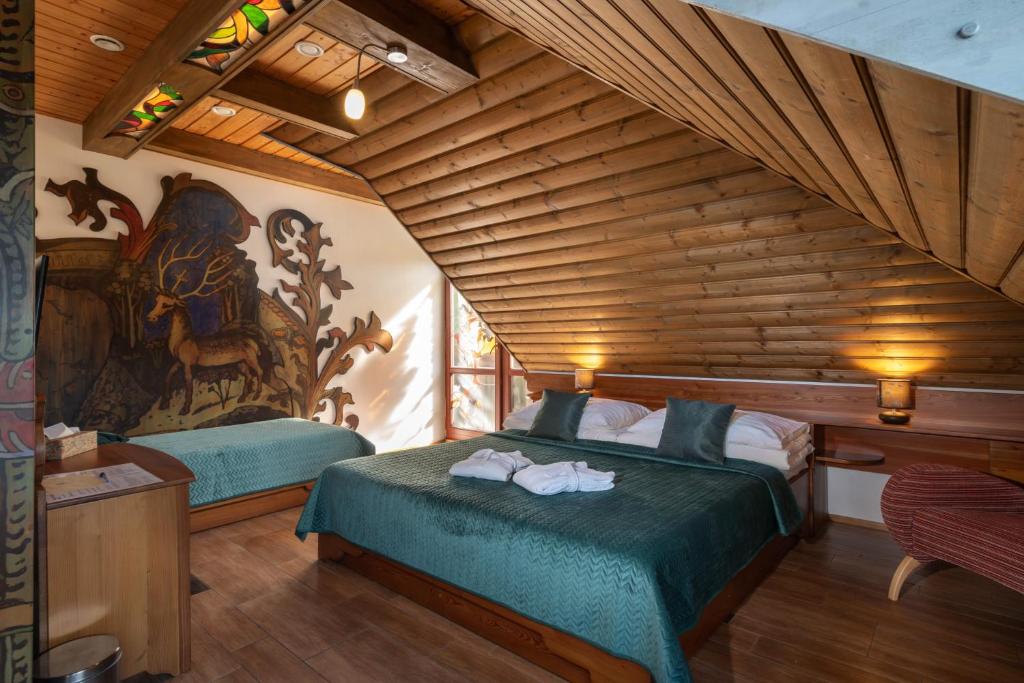 Postel nebo postele na pokoji v ubytování Gašperov Mlyn