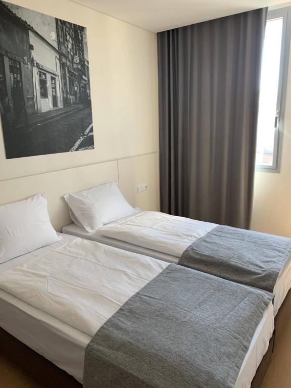 Llit o llits en una habitació de Hotel Areosa