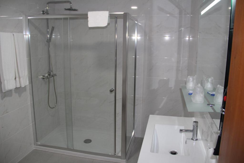 Koupelna v ubytování Troia Hotel