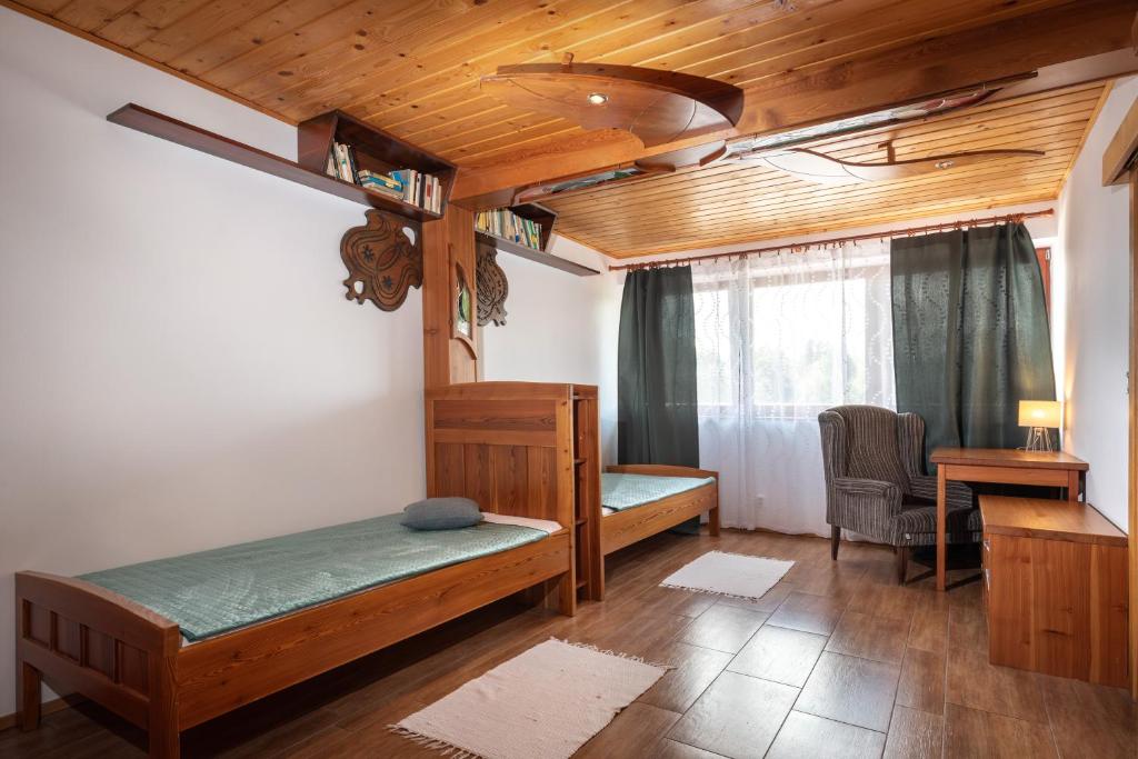 Postel nebo postele na pokoji v ubytování Gašperov Mlyn