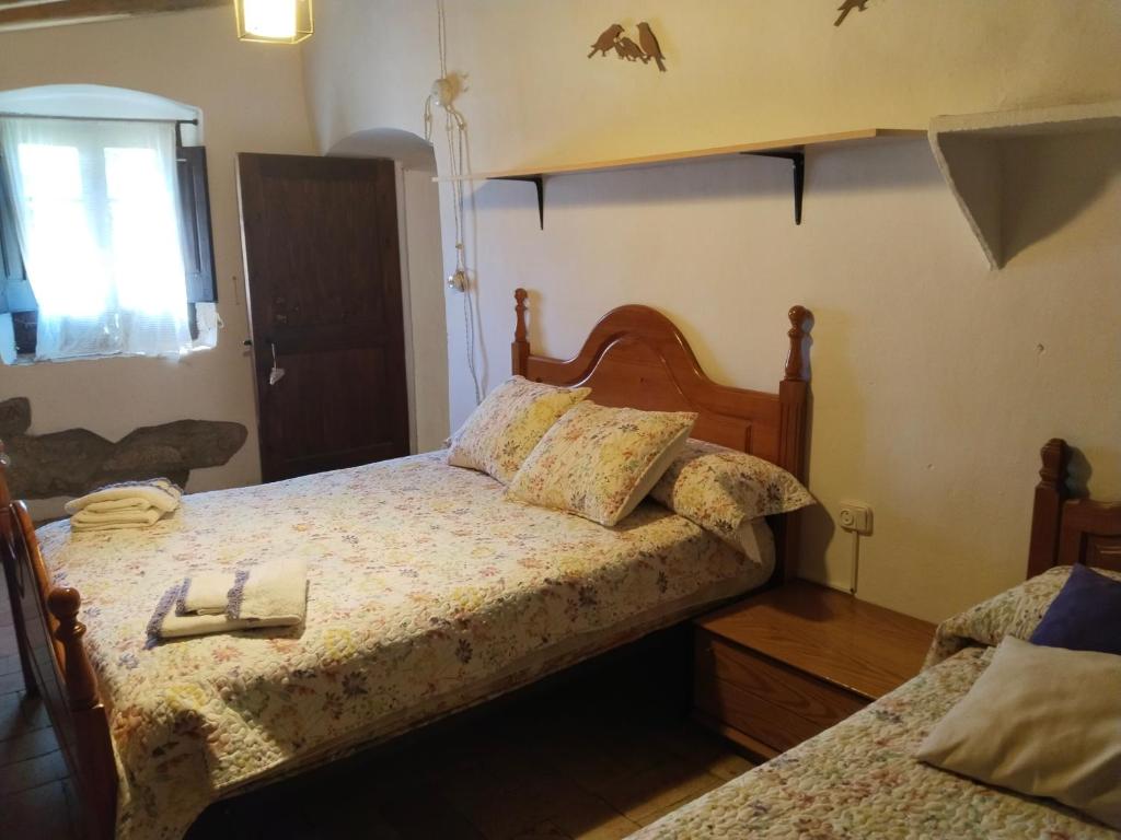 Postel nebo postele na pokoji v ubytování Can Camós - Masia Rural