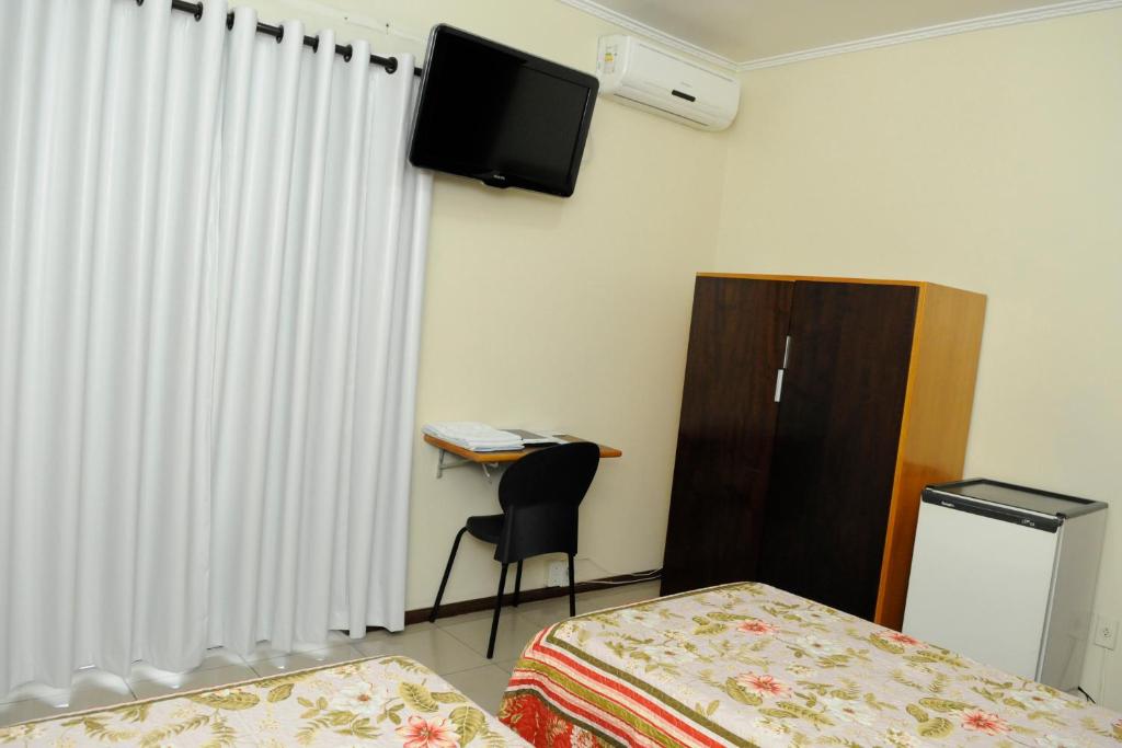 TV a/nebo společenská místnost v ubytování Hotel Cidade
