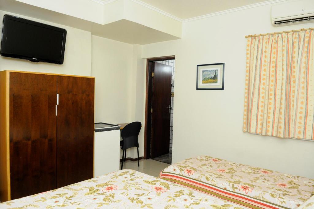 TV a/nebo společenská místnost v ubytování Hotel Cidade