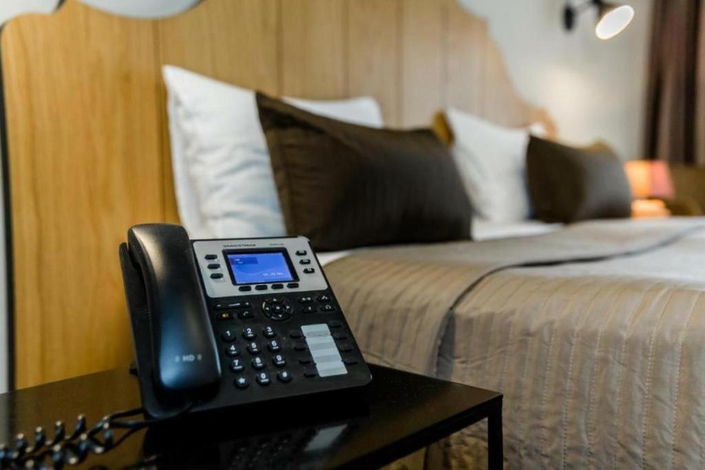 Postel nebo postele na pokoji v ubytování Rasta Maidan Hotel