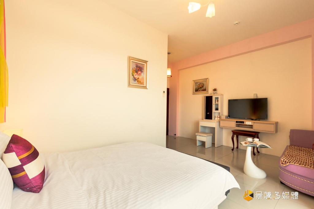 TV a/nebo společenská místnost v ubytování Hong Lai Guest House