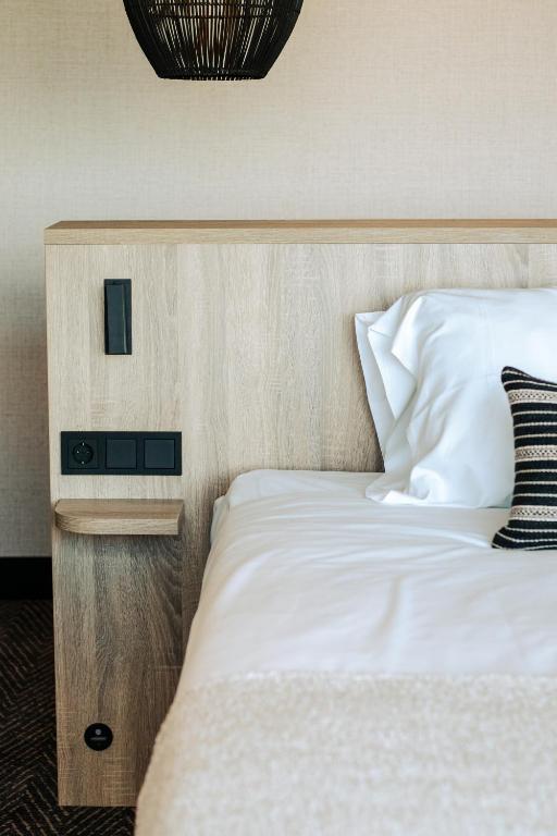Postel nebo postele na pokoji v ubytování Van der Valk Hotel Houten Utrecht