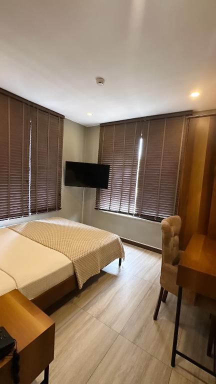 Postel nebo postele na pokoji v ubytování Villa Siesta Hotel Istanbul Airport