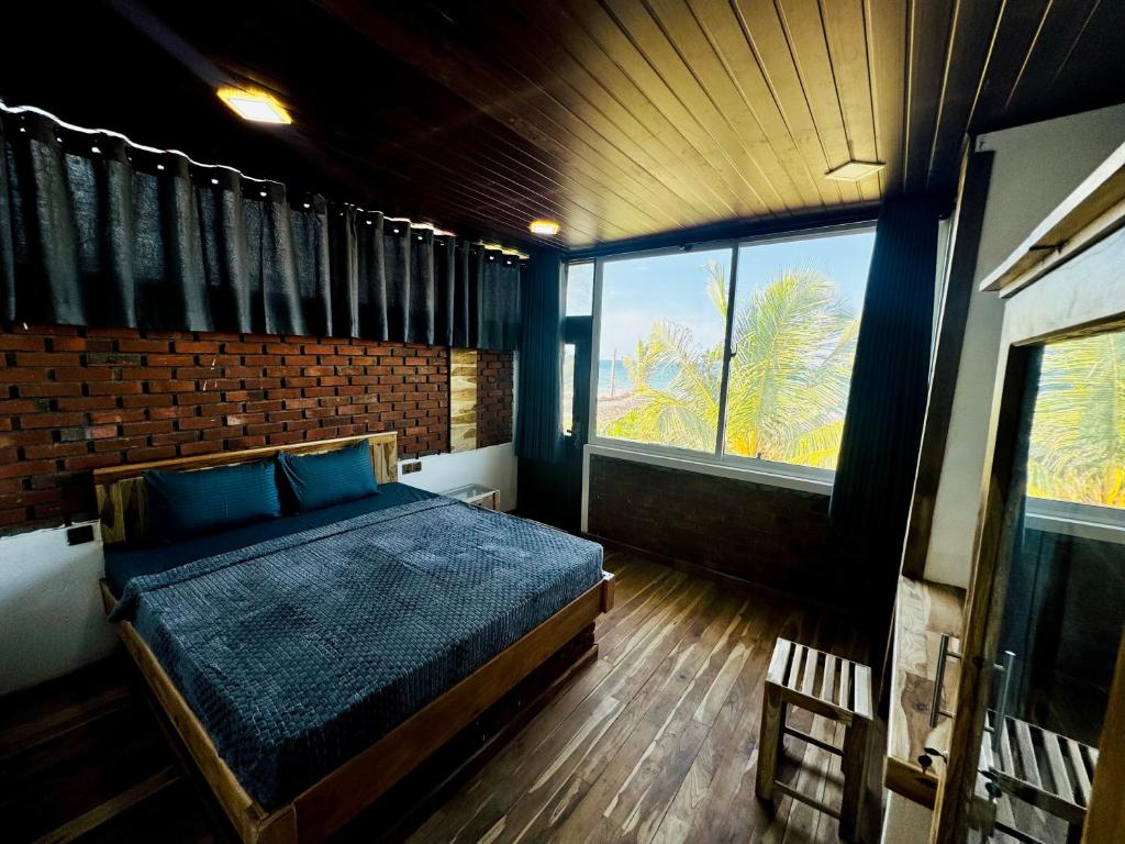 Postel nebo postele na pokoji v ubytování Resort Maya Beach