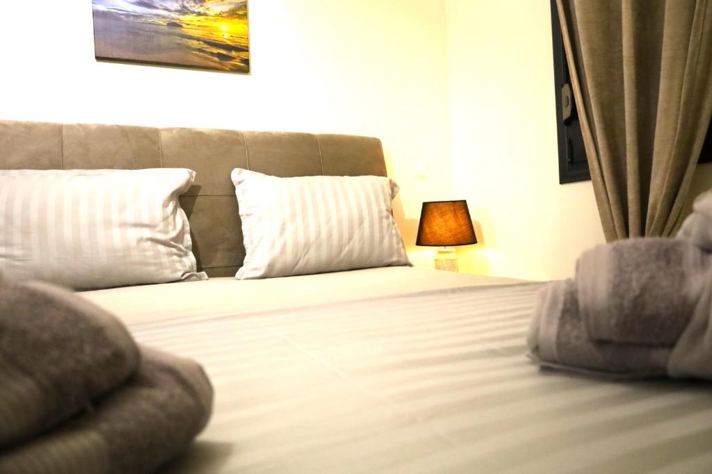 Postel nebo postele na pokoji v ubytování Xanthi BnB3