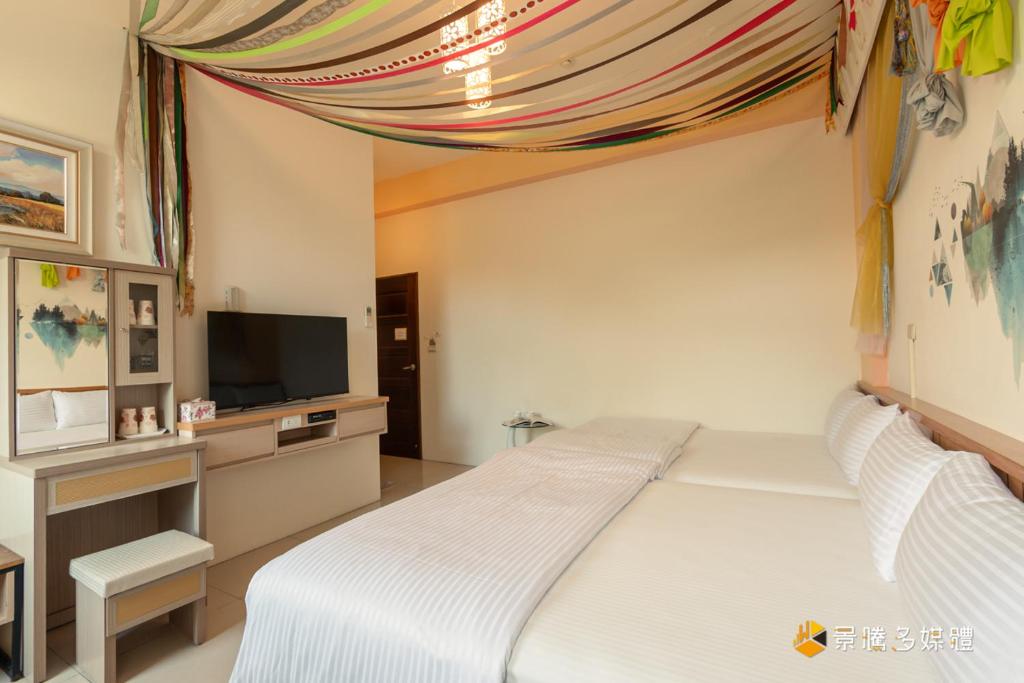 Postel nebo postele na pokoji v ubytování Hong Lai Guest House