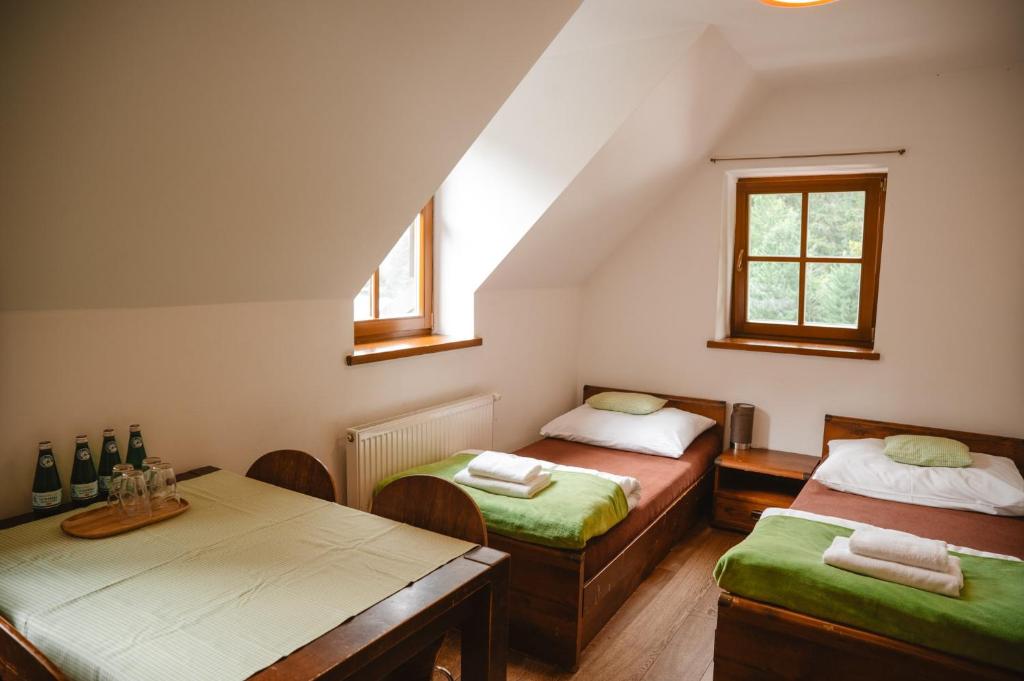 A bed or beds in a room at Majláthova Chata Popradské Pleso