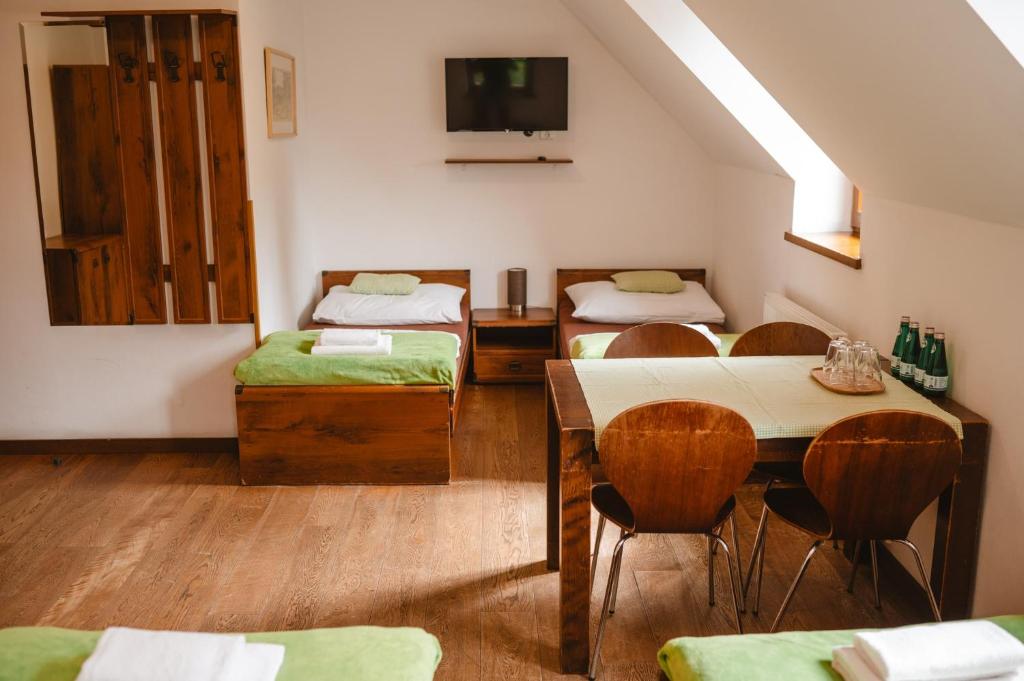 A bed or beds in a room at Majláthova Chata Popradské Pleso