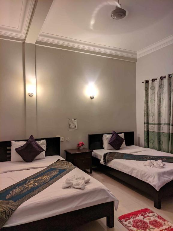 Postel nebo postele na pokoji v ubytování IKI IKI Guesthouse