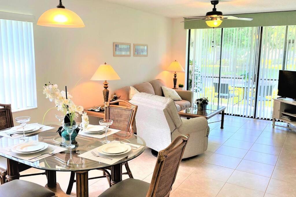 a living room with a table and a couch at Florida Bella Rosa near IMG Academy & beaches in Bradenton