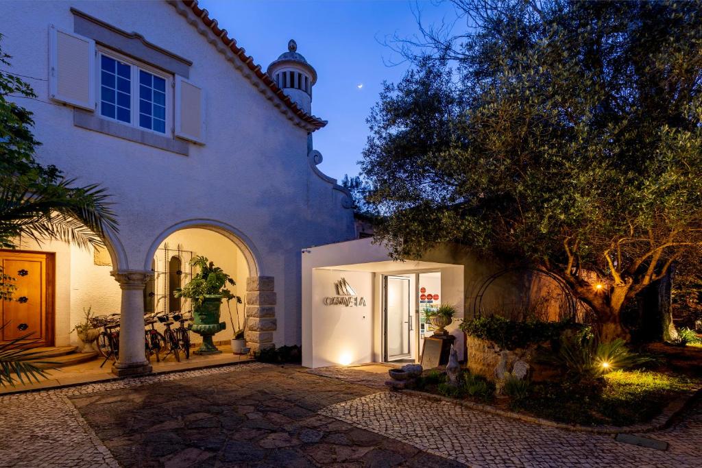 Um jardim em Casa Vela Boutique House