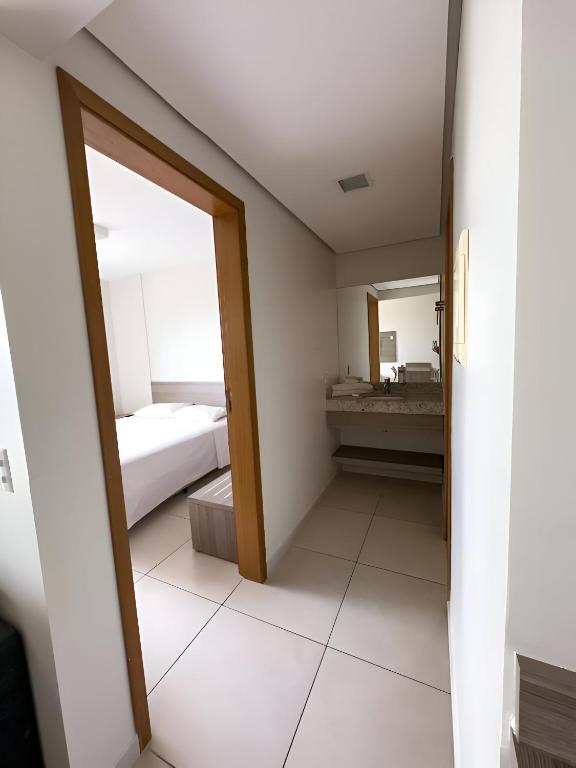 Postel nebo postele na pokoji v ubytování Atrium Thermas Residence Service