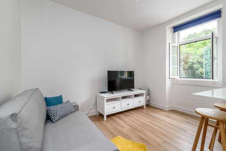 Et tv og/eller underholdning på GuestReady - Cosy flat Santos-o-Velho