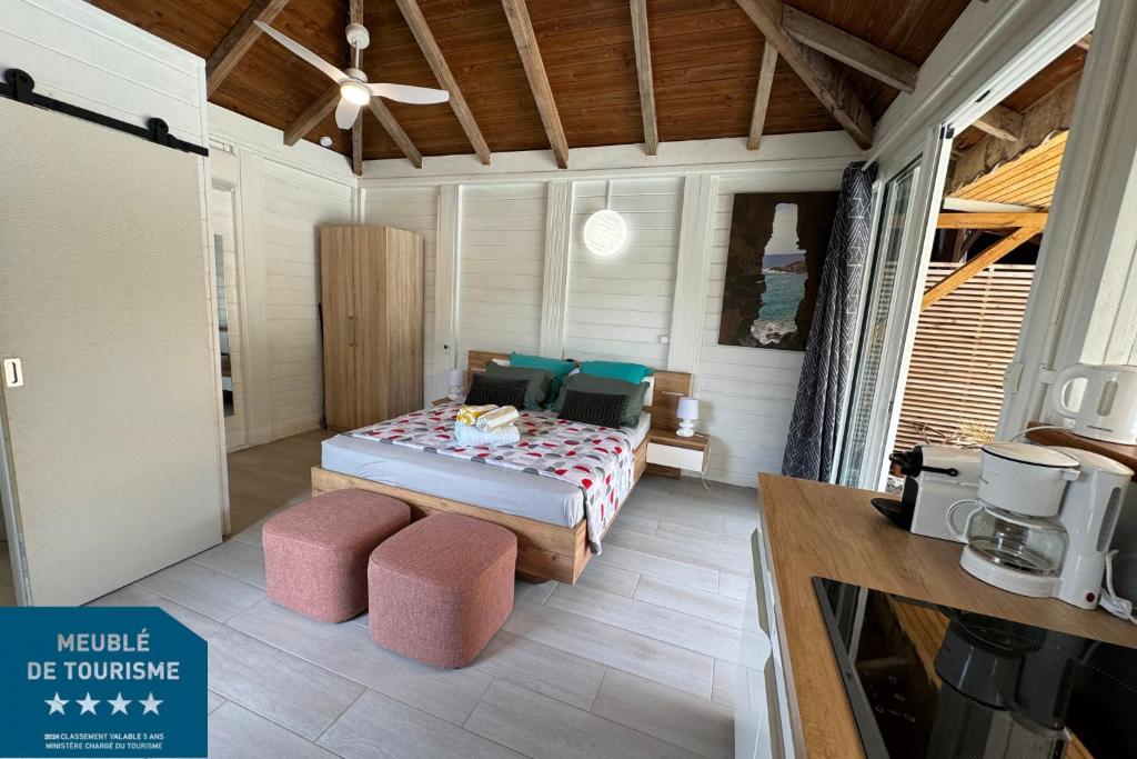 Postel nebo postele na pokoji v ubytování Suite Lagoon climatisée avec piscine, spa privatif