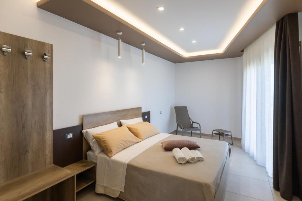 Postel nebo postele na pokoji v ubytování Altum Hotel Tropea