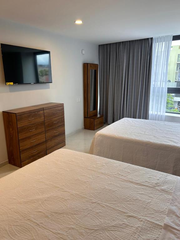 Postel nebo postele na pokoji v ubytování Hotel Concordia