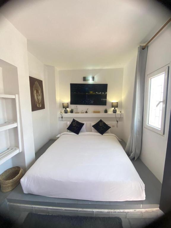 Postel nebo postele na pokoji v ubytování Tweets Hotel