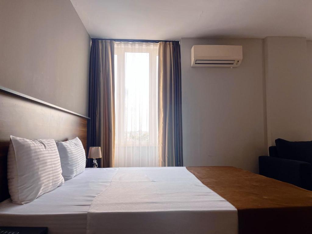 Postel nebo postele na pokoji v ubytování PRIVADO HOTELS