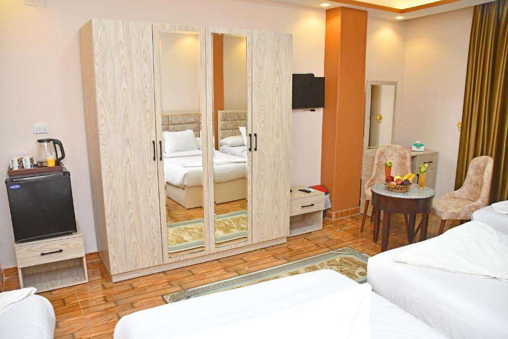 Postel nebo postele na pokoji v ubytování Nun Pyramids Hotel