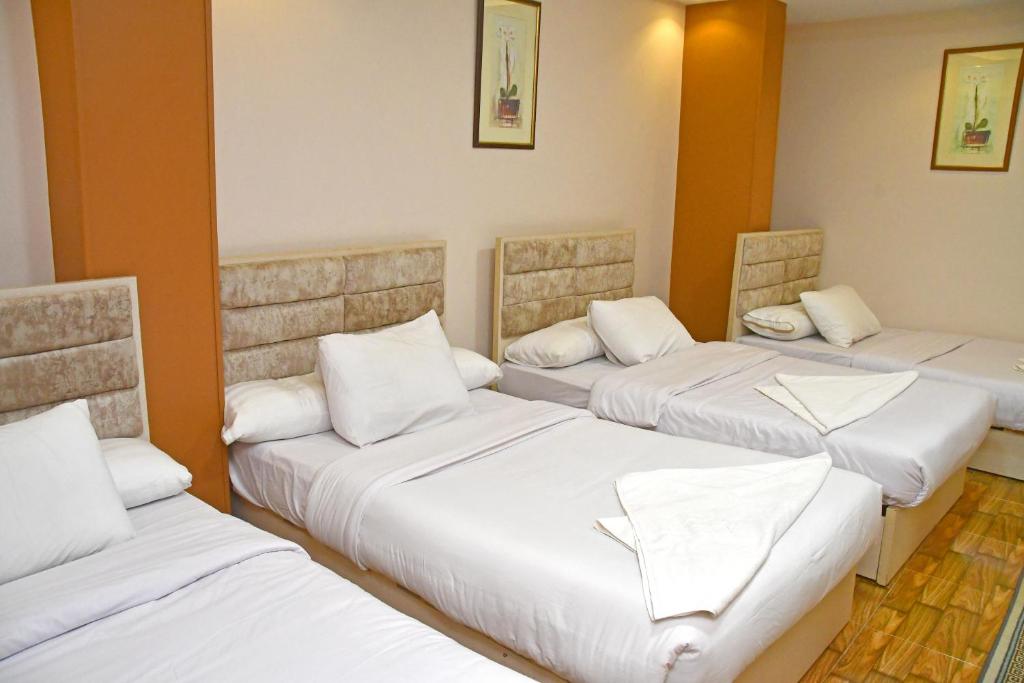 Postel nebo postele na pokoji v ubytování Nun Pyramids Hotel