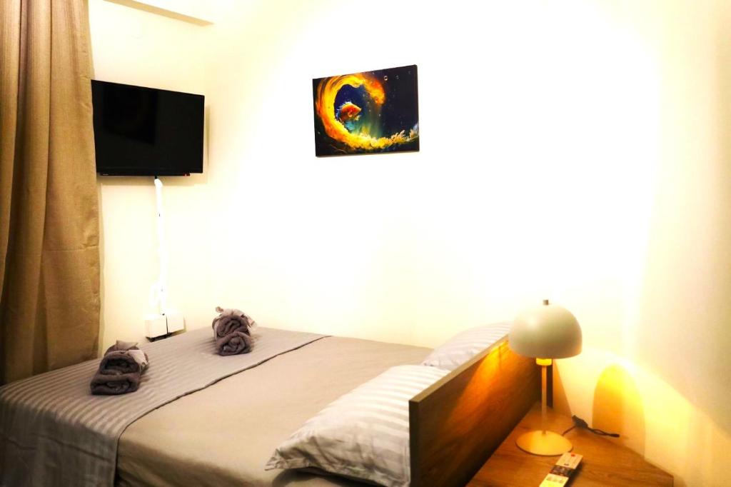 Postel nebo postele na pokoji v ubytování Xanthi BnB3