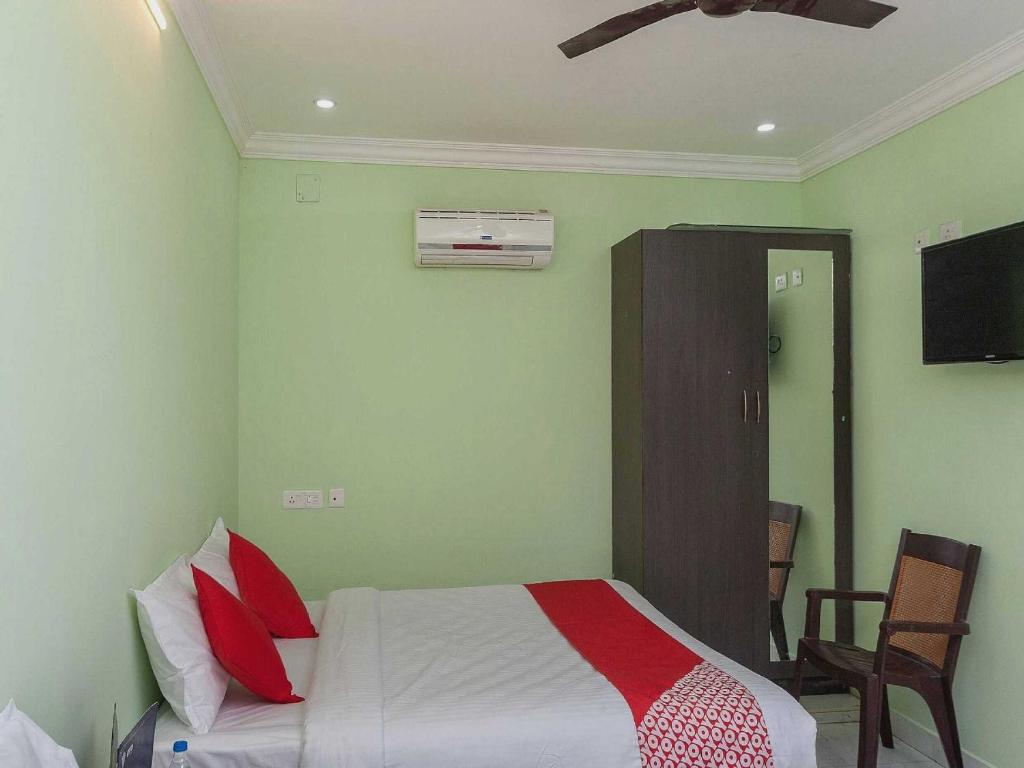 Postel nebo postele na pokoji v ubytování Hotel O Seabreeze Residency
