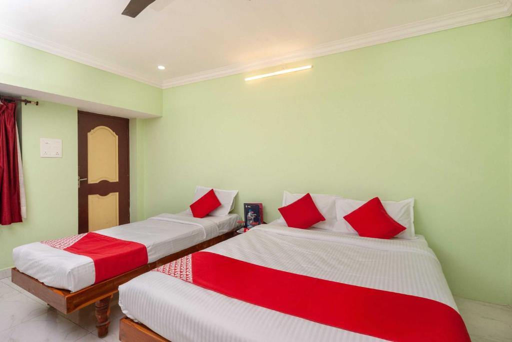 Postel nebo postele na pokoji v ubytování Hotel O Seabreeze Residency