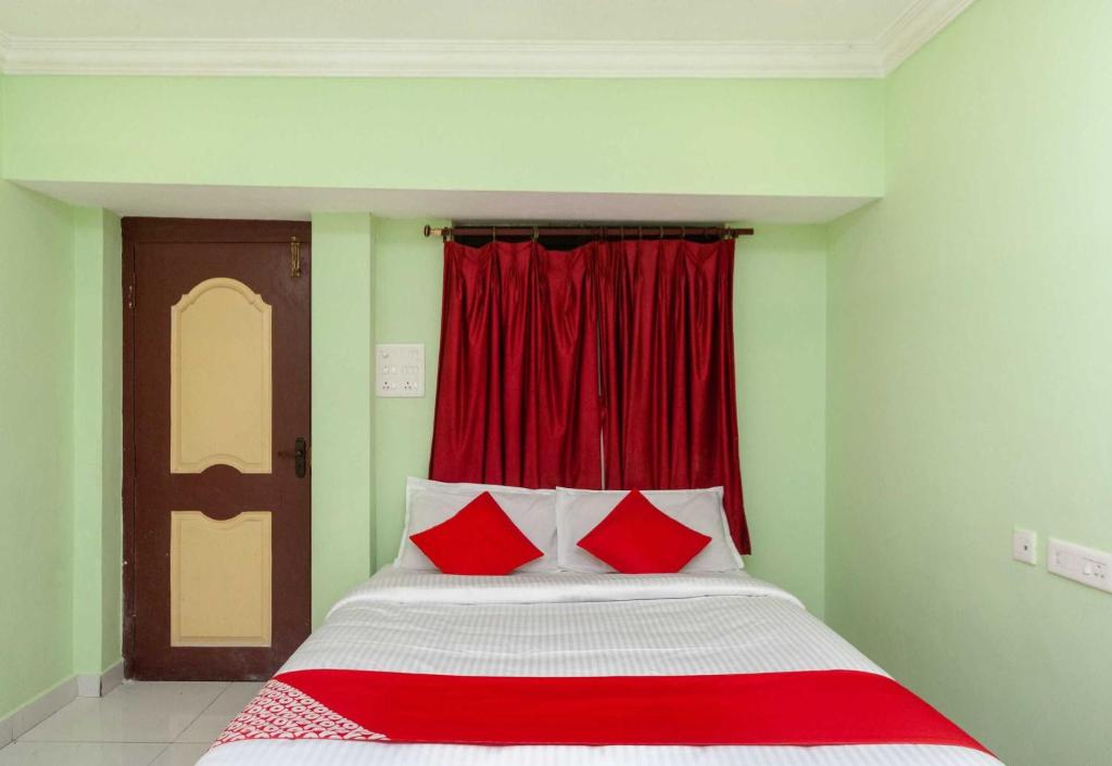 Postel nebo postele na pokoji v ubytování Hotel O Seabreeze Residency