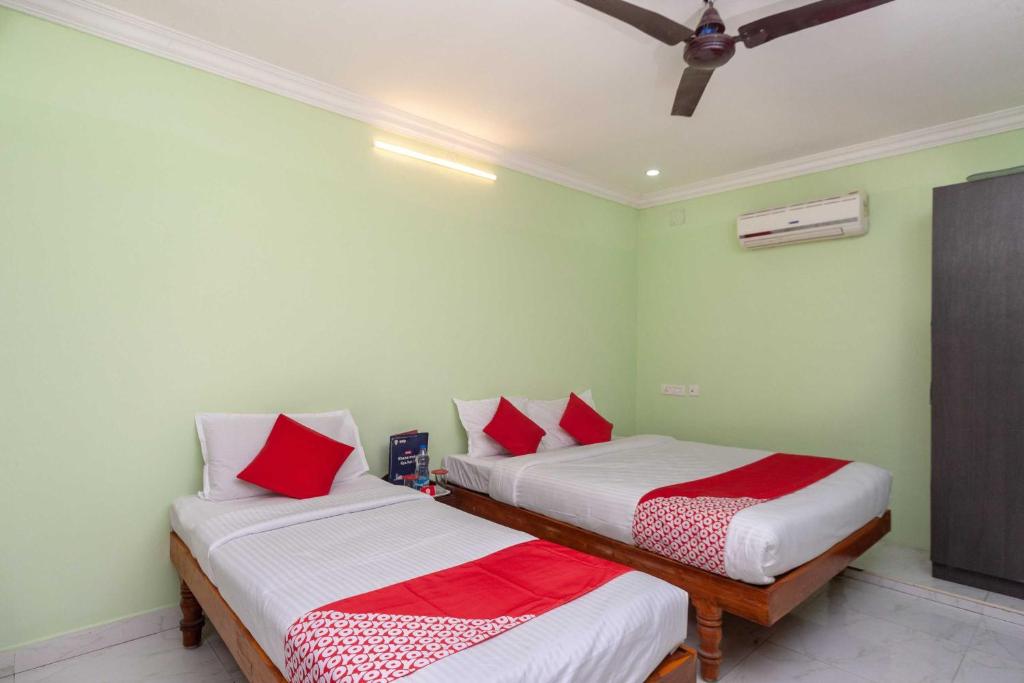 Postel nebo postele na pokoji v ubytování Hotel O Seabreeze Residency