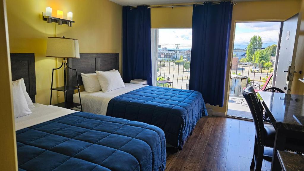 Postel nebo postele na pokoji v ubytování Port-O-Call Inn
