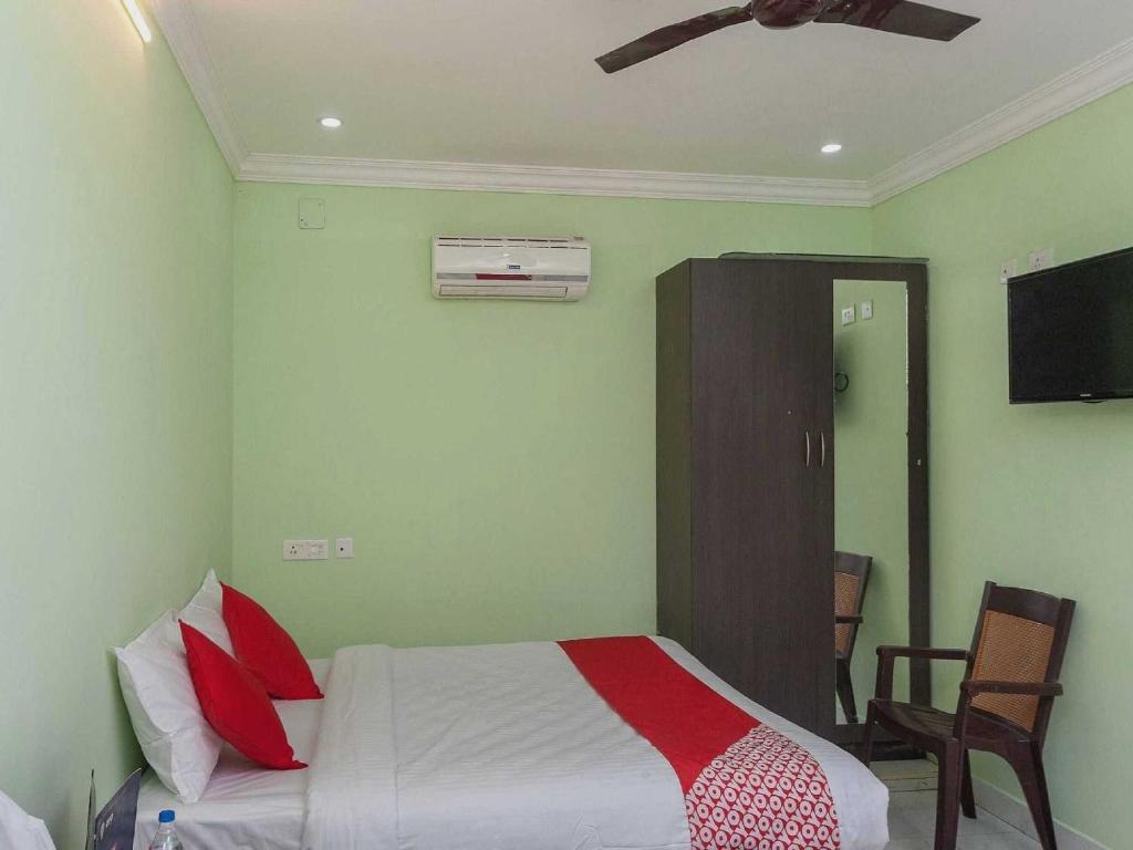 Postel nebo postele na pokoji v ubytování Hotel O Seabreeze Residency
