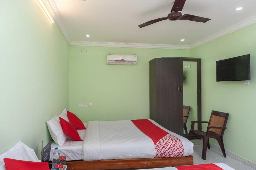 Postel nebo postele na pokoji v ubytování Hotel O Seabreeze Residency