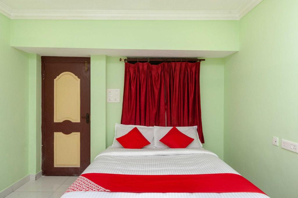 Postel nebo postele na pokoji v ubytování Hotel O Seabreeze Residency