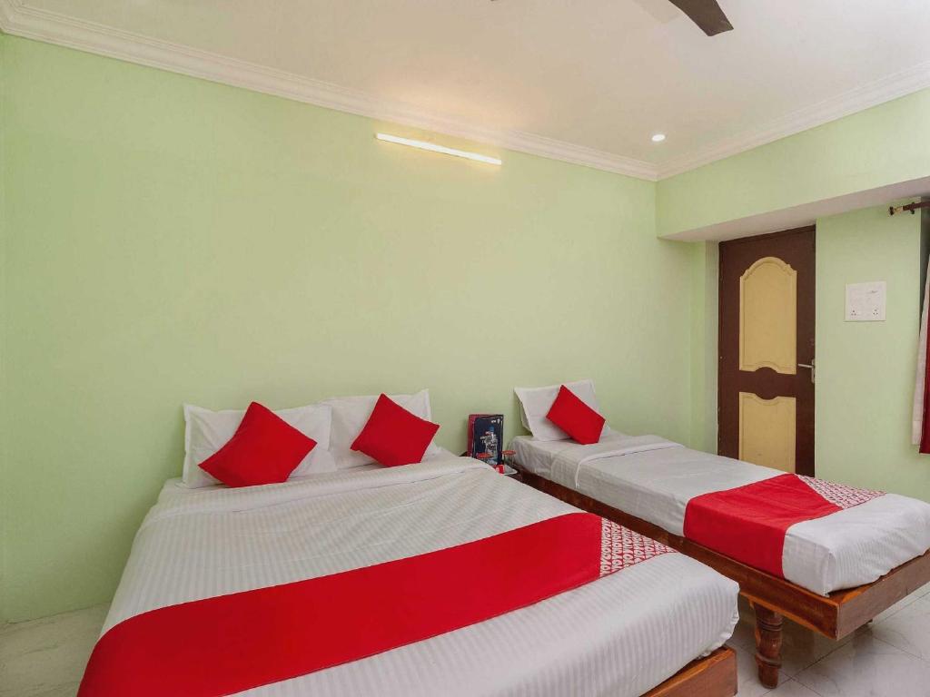 Postel nebo postele na pokoji v ubytování Hotel O Seabreeze Residency