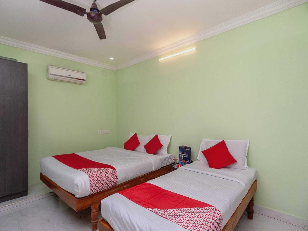 Postel nebo postele na pokoji v ubytování Hotel O Seabreeze Residency