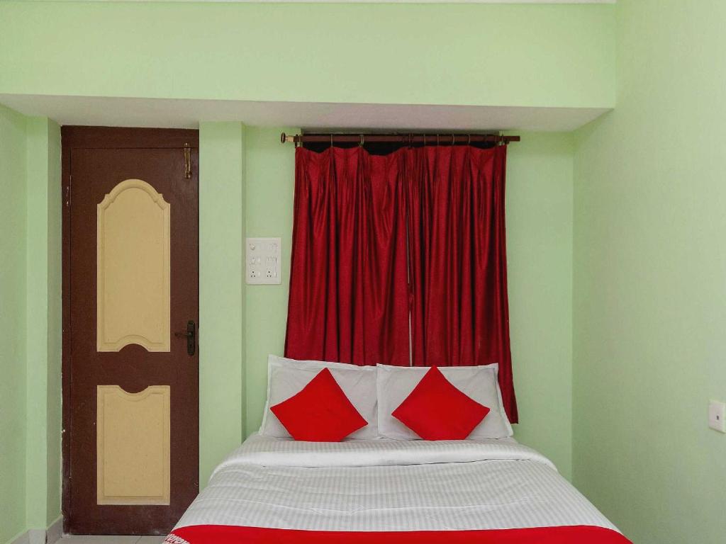 Postel nebo postele na pokoji v ubytování Hotel O Seabreeze Residency