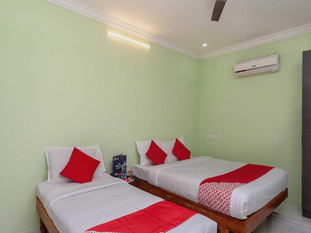 Postel nebo postele na pokoji v ubytování Hotel O Seabreeze Residency