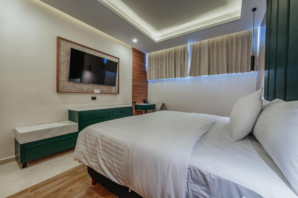 Postel nebo postele na pokoji v ubytování Hotel Chariot