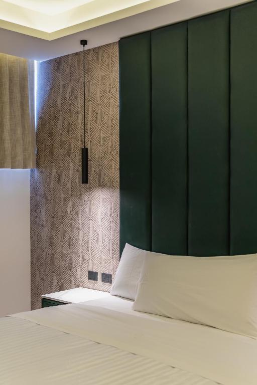 Postel nebo postele na pokoji v ubytování Hotel Chariot