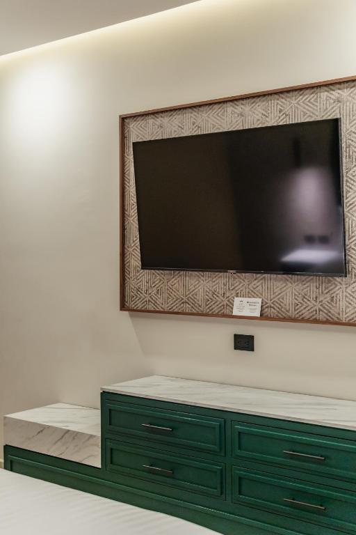 TV a/nebo společenská místnost v ubytování Hotel Chariot