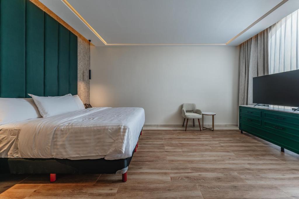 Postel nebo postele na pokoji v ubytování Hotel Chariot