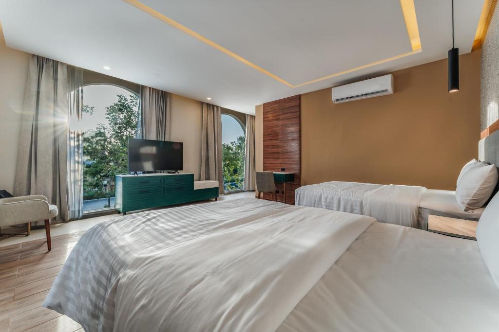 Postel nebo postele na pokoji v ubytování Hotel Chariot