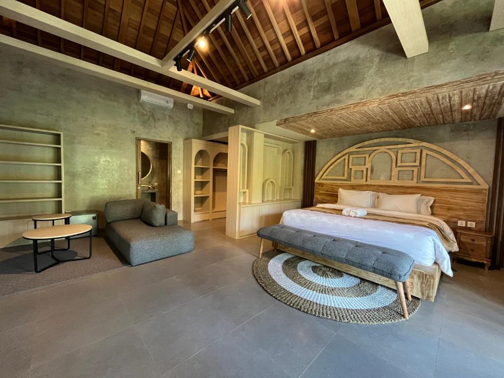 Postel nebo postele na pokoji v ubytování Gandatera Ubud